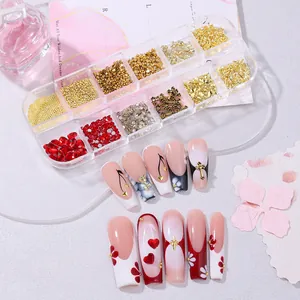 French manicure set with red nails, gold roses, and cross charms in a 12-grid storage box