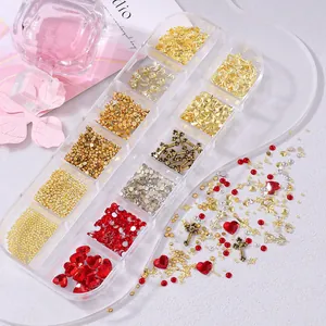 Detail of 12-grid nail art kit with gold crosses, red hearts and metallic charms