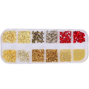 Nail art kit with gold crosses, roses, and red rhinestones in a 12-grid organizer box