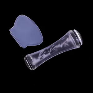 Dual-head clear nail stamper tool with transparent handle and purple silicone cap detail