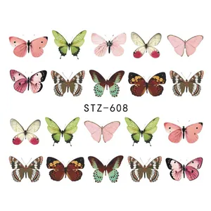 Detalle macro de pegatinas nail art STZ-608 con 20 motivos de mariposas de colores