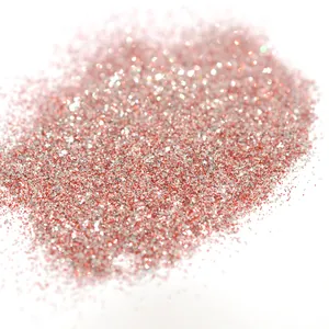 Macro shot of rose gold and silver holographic nail glitter powder for DIY manicure