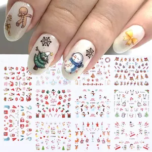 Detail of 3D Christmas nail stickers with gingerbread man and snowflake designs