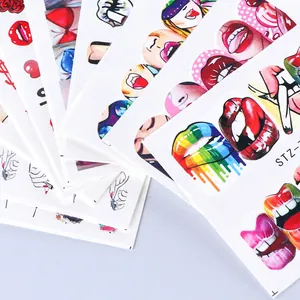 Detailed view of artistic nail stickers featuring colorful lips and rose floral designs