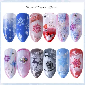 Set of 12 Christmas nail art tips featuring snowflakes, reindeers, and 3D rhinestones