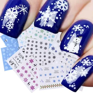 Christmas nail art stickers featuring snowflakes and deer designs for winter manicures