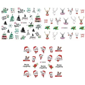 Close-up of Christmas 3D nail stickers featuring Santa, reindeer and holiday greetings
