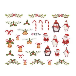 3D Christmas nail art stickers featuring Santa, penguins, and bells for festive manicure