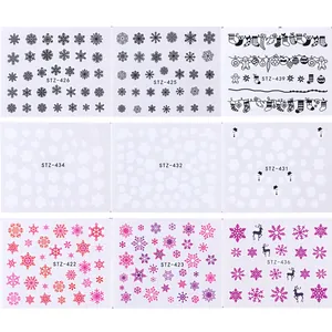 Detailed grid showing nine styles of Christmas nail stickers with snowflakes and reindeer