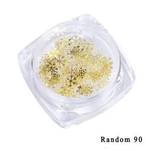90 pièces de flocons de neige dorés en métal 3D pour nail art dans un pot de rangement carré