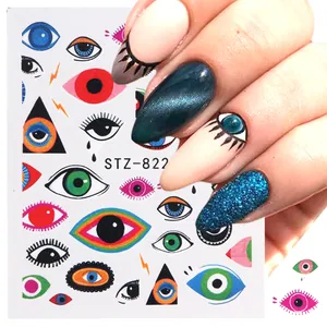 Autocollants d'ongles Evil Eye avec motifs variés colorés et démonstration sur main