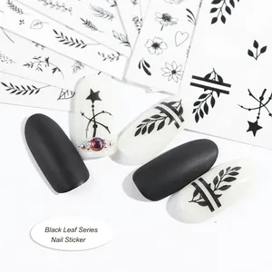 Floral leaf pattern nail stickers with elegant vine designs on matte black and white tips