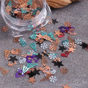 Christmas nail art metal sequins kit with snowflakes and stars in a 12-slot storage box