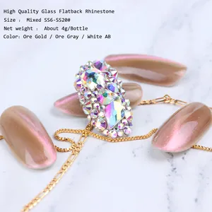 Macro view of assorted glass flatback rhinestones for nail art in ore gold and gray