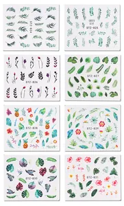 Set of 8 tropical nail art stickers featuring green leaves, flamingos and pineapples