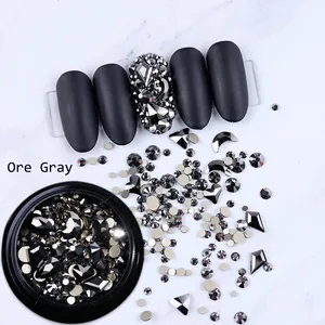 Mixed shape ore gray nail art rhinestones set with metallic crystals and black matte nails