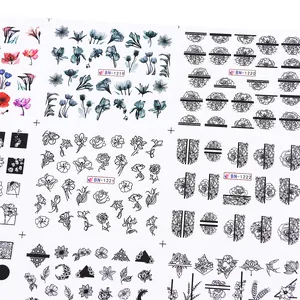 Detailed view of four black and white line art nail stickers with floral patterns