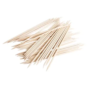 Macro shot of double-headed wooden cuticle sticks for nail cleaning and dead skin removal