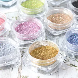Macro shot of colorful metallic nail art glitter powder set in clear jars for manicure DIY