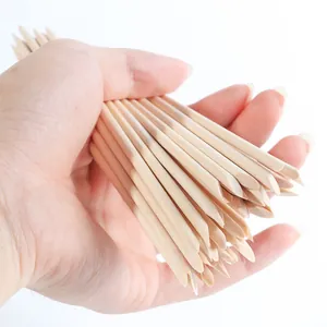 Dual-tip orange wood sticks for nail art cuticle removal and cleaning in a 100-piece pack