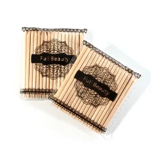 Detail of double-sided orange wood sticks for cuticle cleaning and nail art tools