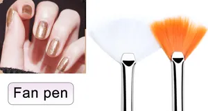 Detail view of nail art fan brushes with white and orange bristles for creative designs