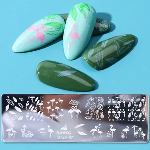 Macro detail of STZH-07 nail stamping plate with flamingo and tropical leaf patterns