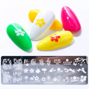 Macro detail of STZH-02 nail stamping plate with blooming sakura and floral patterns