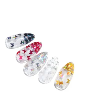 Paillettes papillon laser cinq couleurs sur faux ongles ovales transparents en set
