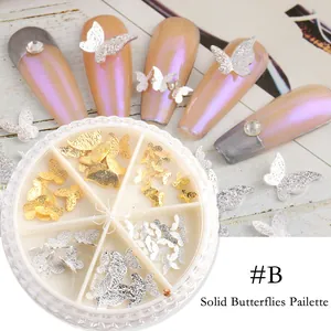 Detalle de lentejuelas de mariposa 3D de metal dorado y plateado para decorar las uñas