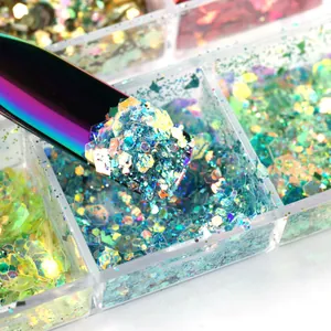 Detail of a metal tool picking up iridescent hexagonal nail glitters from a storage box