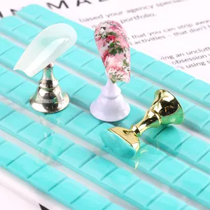 Manicure display set with metallic stands and blue adhesive clay for nail art practice