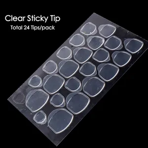 Detailed view of 24-piece clear sticky nail adhesive tabs for false nail application