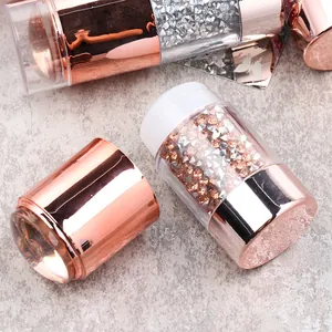Dual-ended rose gold nail art stamper tool with champagne diamonds and silicone heads
