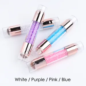 Close-up of double-headed nail art wax pens with acrylic handles and crystals