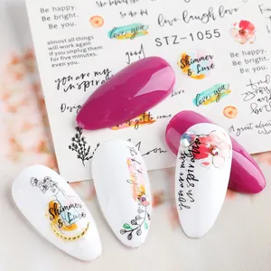 Macro detail of STZ-1055 nail art stickers with floral patterns and English quotes