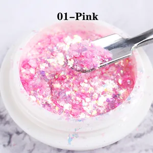 Macro shot of pink opal nail powder in jar with metallic spatula for manicures