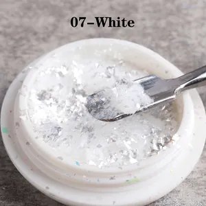 Macro detail of 07-White iridescent opal nail powder in a round container