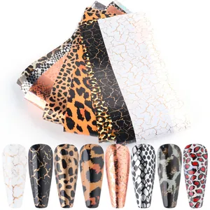 Macro view of animal print nail transfer foils with leopard and snake skin patterns