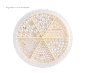 Flat back white nail pearls in 1.5mm to 5.0mm sizes within a 6-grid circular storage case