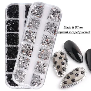 12-grid nail art kit with black and silver resin shapes like stars and hearts on models