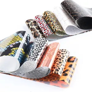 Detailed view of nail art transfer foils with leopard and snake skin patterns