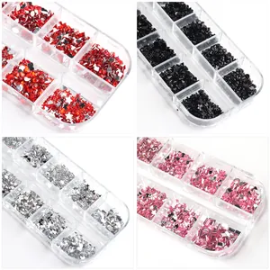 Macro view of 12-slot nail art glitter sets with heart and star shapes in four colors