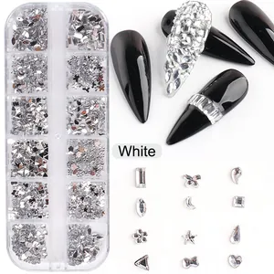 Detail of 12-grid nail art kit with white resin hearts and silver stars decoration