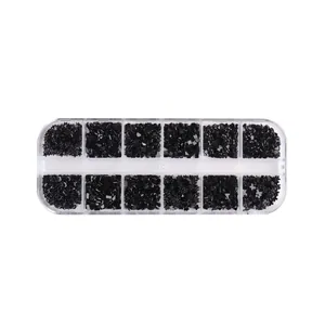 12-grid nail art kit with black resin hearts, stars, and moon shapes in clear box