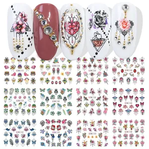 Détail de stickers nail art papillon et fleurs avec effet d'application et lot de 12 modèles