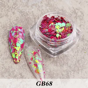 Detailed view of magenta and neon green hexagonal nail sequins in a clear jar GB68