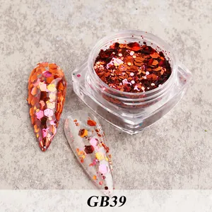 Detail view of chunky orange-red hexagonal nail glitter showing full and partial coverage