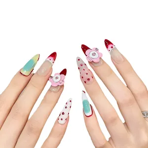 Handmade stiletto press-on nails with 3D floral accents and red gradient French tips