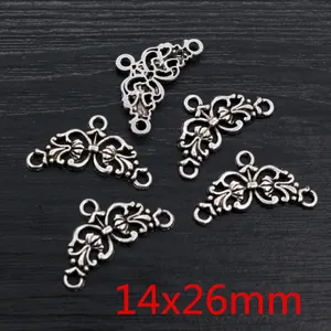 Detail of 14x26mm antique silver alloy pendants with hollow filigree and triple loop connectors